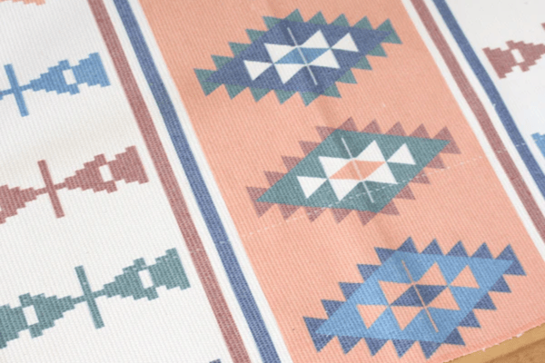 Egyptian Style Braided Rug with Obelisk Patterns and Retro Design